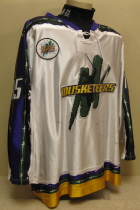 Worn during the 05-06 season by Kevin Lohry. This #15 jersey  was worn by Sioux City native shows lots of wear. Kevin started his hockey career in the Sioux City Youth program and played all through high school. Kevin split his senior year between the Metros and Musketeers.  The following season, 2005-06, he would earn a full time spot on the Musketeer rooster and the next season, 2006-07, he would go on to be named alternate captain and, secure a scholarship at Princeton University.  All-Star Game Patch and NOB . Manufactured by OT Sports, this size 56 shows great wear. 
